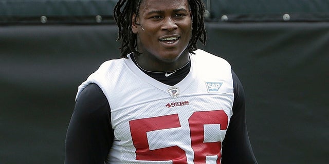 San Francisco 49ers linebacker Reuben Foster walks on the field during a practice at the team's NFL football training facility in Santa Clara, Calif.