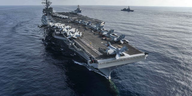 The F/A 18 crew was located by a USS Ronald Reagan search and rescue aircraft.