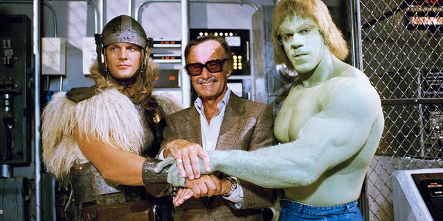 FILE - In this May 9, 1988, file photo, comics impresario Stan Lee, center, poses with Lou Ferrigno, right, and Eric Kramer who portray 'The Incredible Hulk' and Thor, respectively, in a special movie for NBC, 'The Incredible Hulk Returns,' May 9, 1988, Los Angeles, Calif.