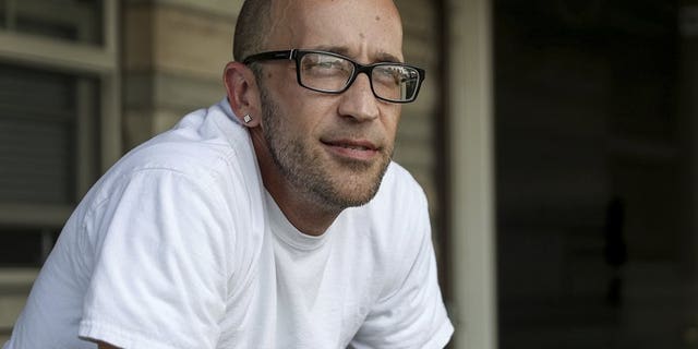 In this Aug. 13, 2018, file photo, Tyson Timbs poses for a portrait at his aunt's home in Marion, Ind. Five years ago, Timbs had his $42,000 Land Rover taken by the government in a process known as "civil asset forfeiture," after he pled guilty to selling $260 of heroin.