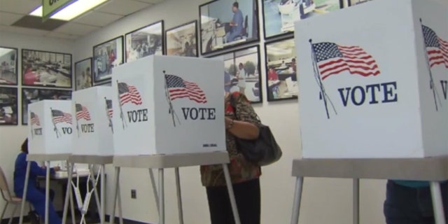 Jean Pogue, who turns 100 this month, says she likes going to vote because, "you get to go to one of those little booths and you look at that fancy ballot."