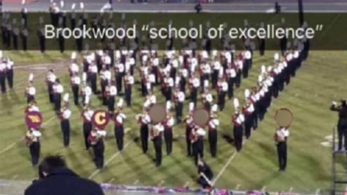 Image result for marching band spells out racial word