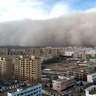 A sandstorm hits the city of Zhangye in Gansu province, China, Nov. 25, 2018.