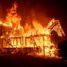 A home burns as the Camp Fire rages through Paradise, California, November 8, 2018. 