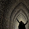 Children walk through the Cathedral of Light as part of the illuminated trail through Kew Gardens magnificent after-dark landscape, lit up by over one million twinkling lights in London, Nov. 21, 2018. 