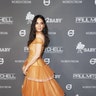 Olivia Munn dons a bright orange gown for the 2018 Baby2Baby Gala presented by Paul Mitchell at 3LABS on November 10, 2018 in Culver City, Calif.