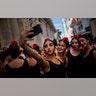 Young flamenco dancers take a selfie before performing in the street during the 26th International Ballet Festival in Havana, Cuba, November. 4, 2018.