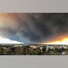 A massive plume from the Camp Fire, burning in the Feather River Canyon wafts over the Sacramento Valley as seen from Chico, California, November 8, 2018. 