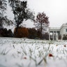 Snow covers the grass outside of the White House in Washington, November 15, 2018.