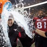 Calgary Stampeders coach Dave Dickenson is doused with ice water after the Stampeders defeated the Ottawa Redblacks in the Canadian Football League Grey Cup in Edmonton, Alberta, Nov. 25, 2018. 