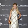 Actress Busy Philipps shimmers on the red carpet at the 2018 Baby2Baby Gala presented by Paul Mitchell at 3LABS on November 10, 2018 in Culver City, Calif.