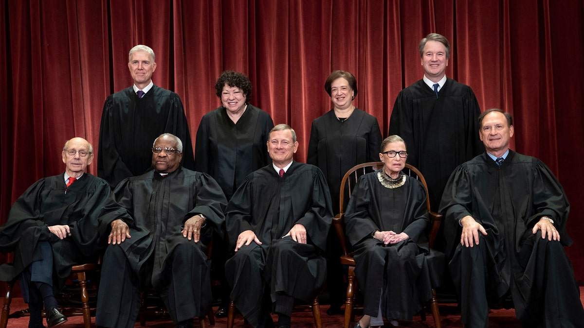 The justices of the U.S. Supreme Court gather for a formal group portrait to include the new Associate Justice, top row, far right, at the Supreme Court Building in Washington, Friday, Nov. 30, 2018. Seated from left: Associate Justice Stephen Breyer, Associate Justice Clarence Thomas, Chief Justice of the United States John G. Roberts, Associate Justice Ruth Bader Ginsburg and Associate Justice Samuel Alito Jr. Standing behind from left: Associate Justice Neil Gorsuch, Associate Justice Sonia Sotomayor, Associate Justice Elena Kagan and Associate Justice Brett M. Kavanaugh. (AP Photo/J. Scott Applewhite)