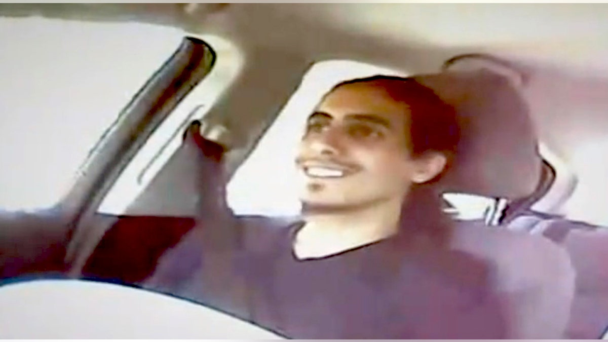 This image from video shows Amer Alhaggagi riding with an undercover FBI agent.