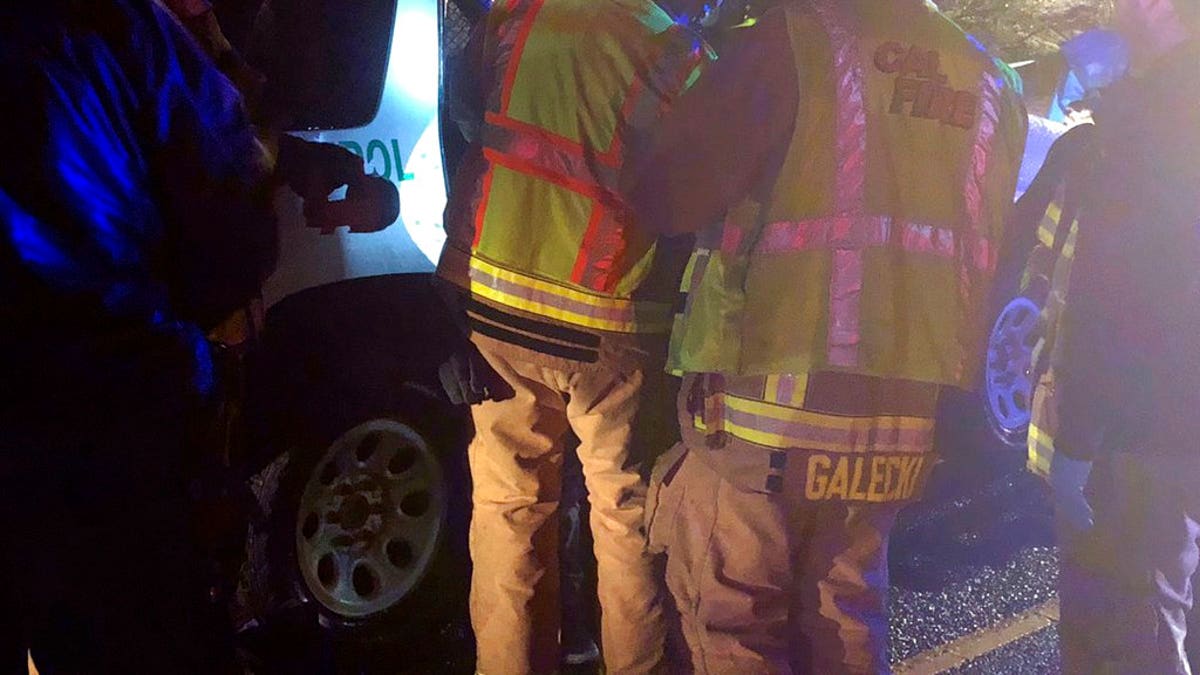 Cal Fire San Diego firefighters work at the scene of a crash along westbound Interstate 8 in Campo, Calif.