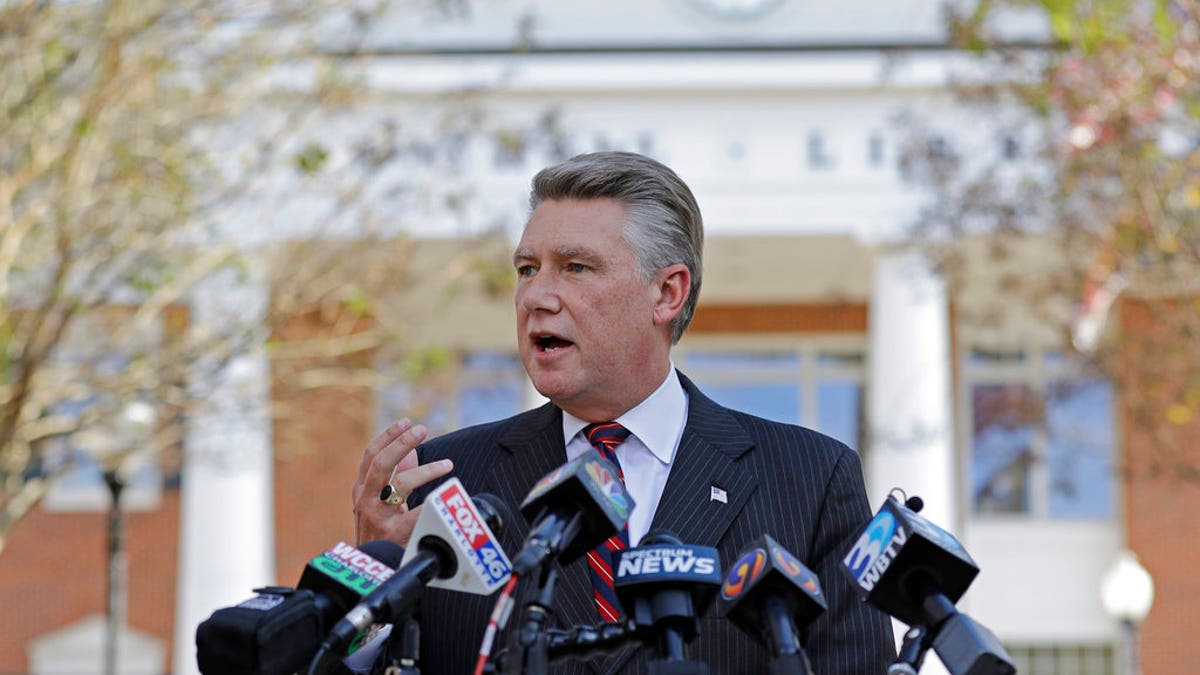 FILE- In this Nov. 7, 2018, file photo Mark Harris speaks to the media during a news conference in Matthews, N.C. North Carolina election officials agreed Friday, Nov. 30, to hold a public hearing into alleged “numerous irregularities” and “concerted fraudulent activities” involving traditional mail-in absentee ballots in the 9th Congressional District. (AP Photo/Chuck Burton, File)