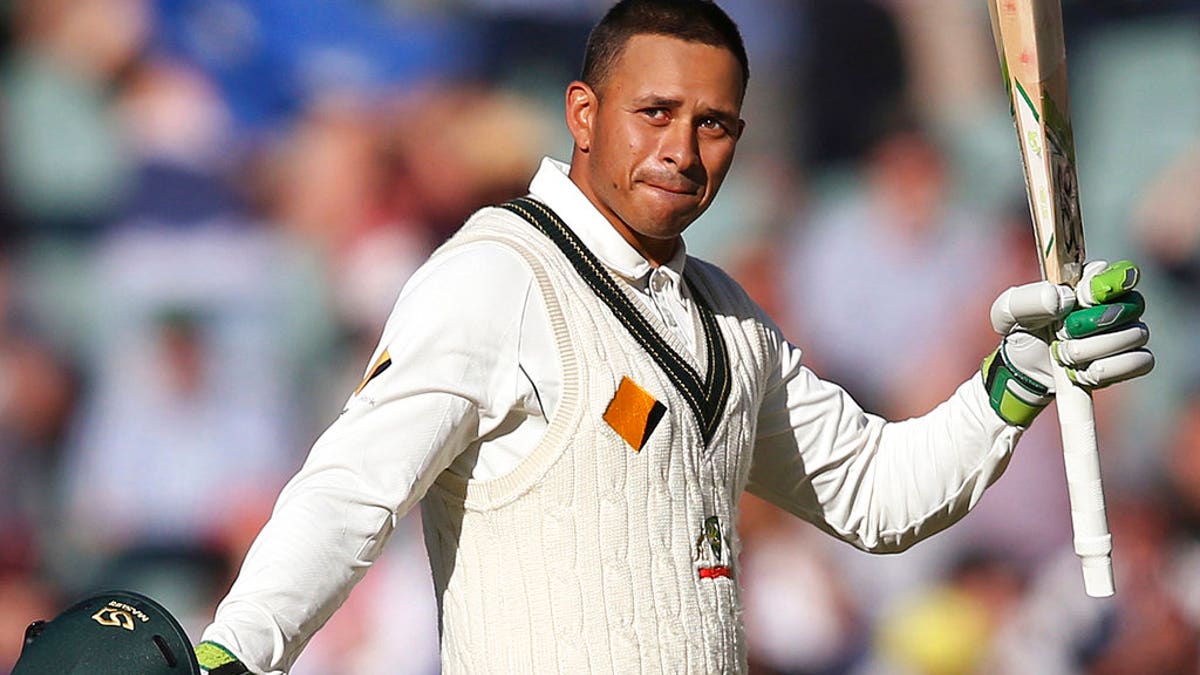 In this Nov. 25, 2016, file photo, Australia's Usman Khawaja celebrates making 100 runs against South Africa during their cricket test match in Adelaide, Australia. Khawaja's brother Arsalan Khawaja has been arrested, Tuesday, Dec. 4, 2018, as part of a counter-terrorism operation focusing on a plot to assassinate former prime minister Malcolm Turnbull.