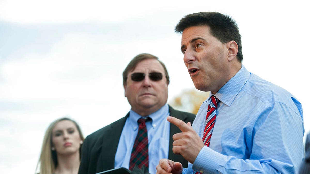 FILE - In this Nov. 23, 2016, file photo, Dallas Woodhouse, North Carolina Republican Party executive director, speaks during a news conference outside the Durham County Board of Elections in Durham, N.C. Woodhouse says the organization would be open to a new election if an investigation were to find a high likelihood that wrongdoing swayed the state’s unresolved congressional race. (Kaitlin McKeown/The Herald-Sun via AP, File)