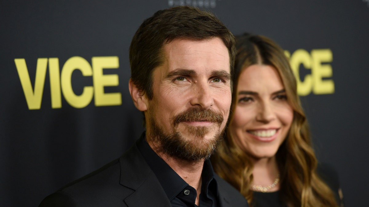 Christian Bale, left, and Sibi Blazic arrive at the world premiere of "Vice" on Tuesday, Dec. 11, 2018, at the Samuel Goldwyn Theater in Beverly Hills, Calif.
