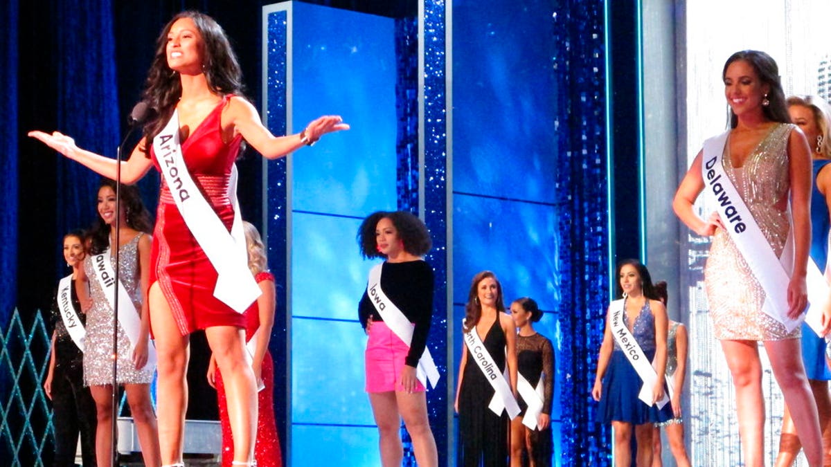 Miss Arizona Isabel Ticlo introduces herself at the start of the third and final night of preliminary competition at the Miss America competition in Atlantic City, N.J., earlier this year. (Associated Press)