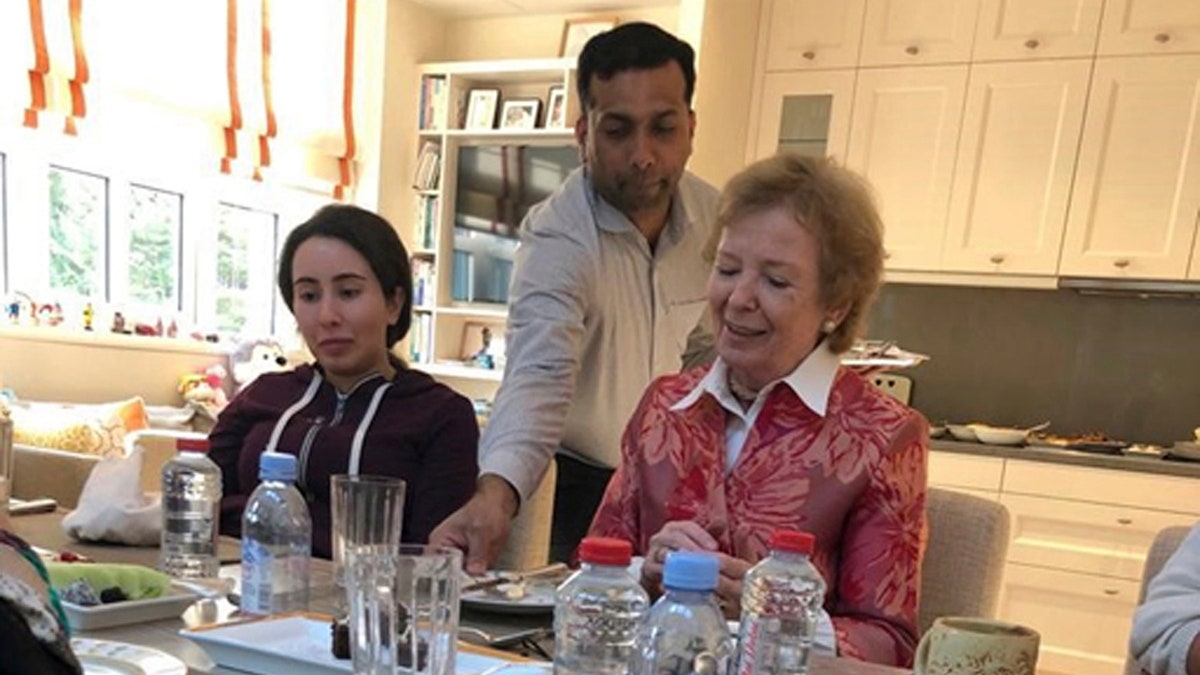 Sheikha Latifa bint Mohammed Al Maktoum, a daughter of Dubai's ruler Sheikh Mohammed bin Rashid Al Maktoum, left, eats a meal with Mary Robinson, a former United Nations High Commissioner for Human Rights and former president of Ireland, right, in Dubai, United Arab Emirates. (United Arab Emirates Ministry of Foreign Affairs and International Cooperation via AP)