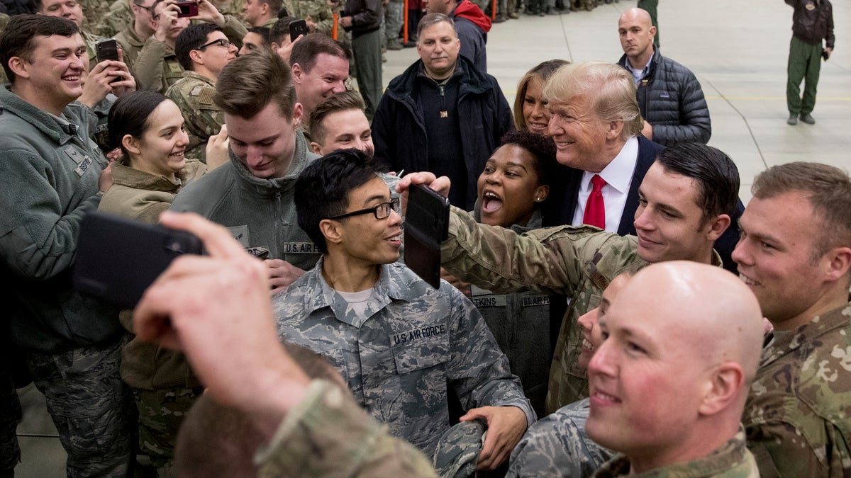 President Donald Trump and first lady Melania Trump greet members of the military at Ramstein Air Base, Germany, Thursday, Dec. 27, 2018. (AP Photo/Andrew Harnik)