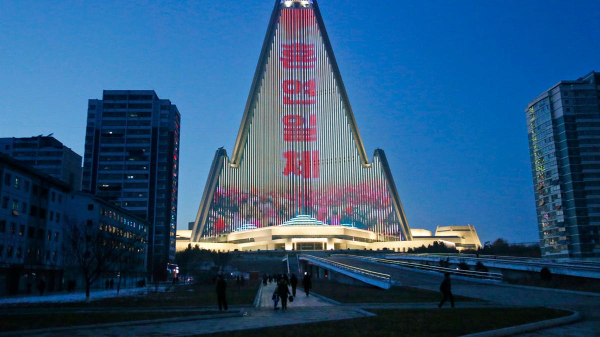 A propaganda message is displayed on the facade of the pyramid-shaped Ryugyong Hotel in Pyongyang, North Korea.
