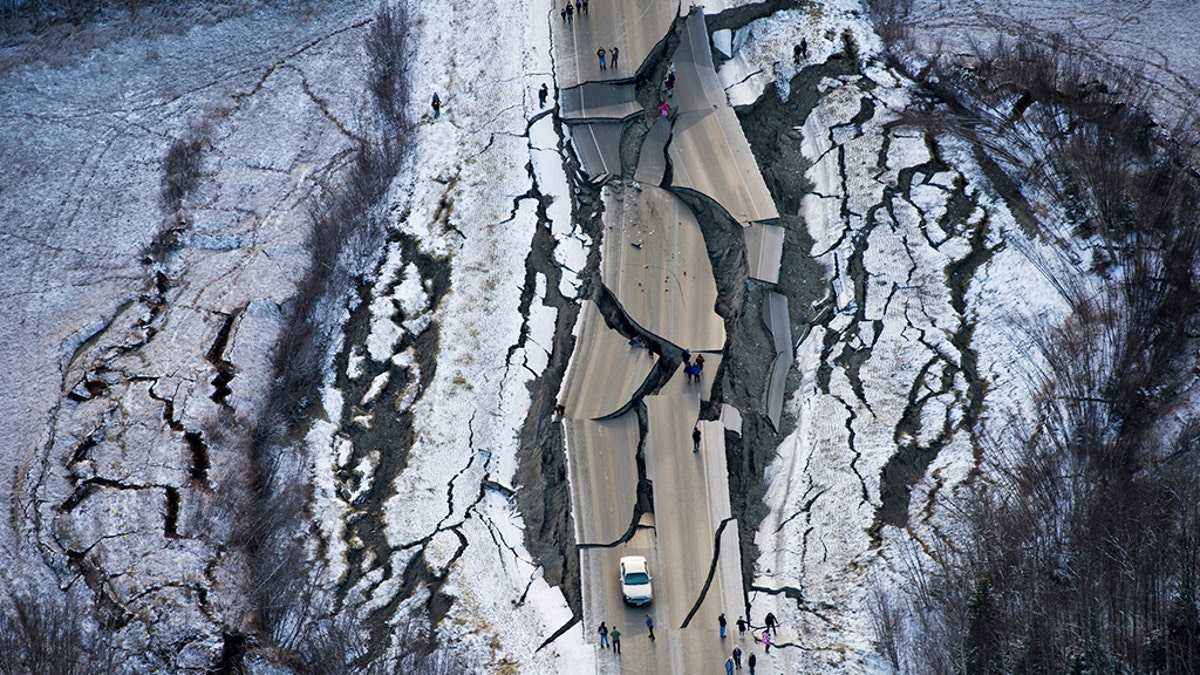 Aerial photo shows damage on Vine Road, south of Wasilla, Alaska, after earthquake Friday. (Marc Lester/Anchorage Daily News via AP)
