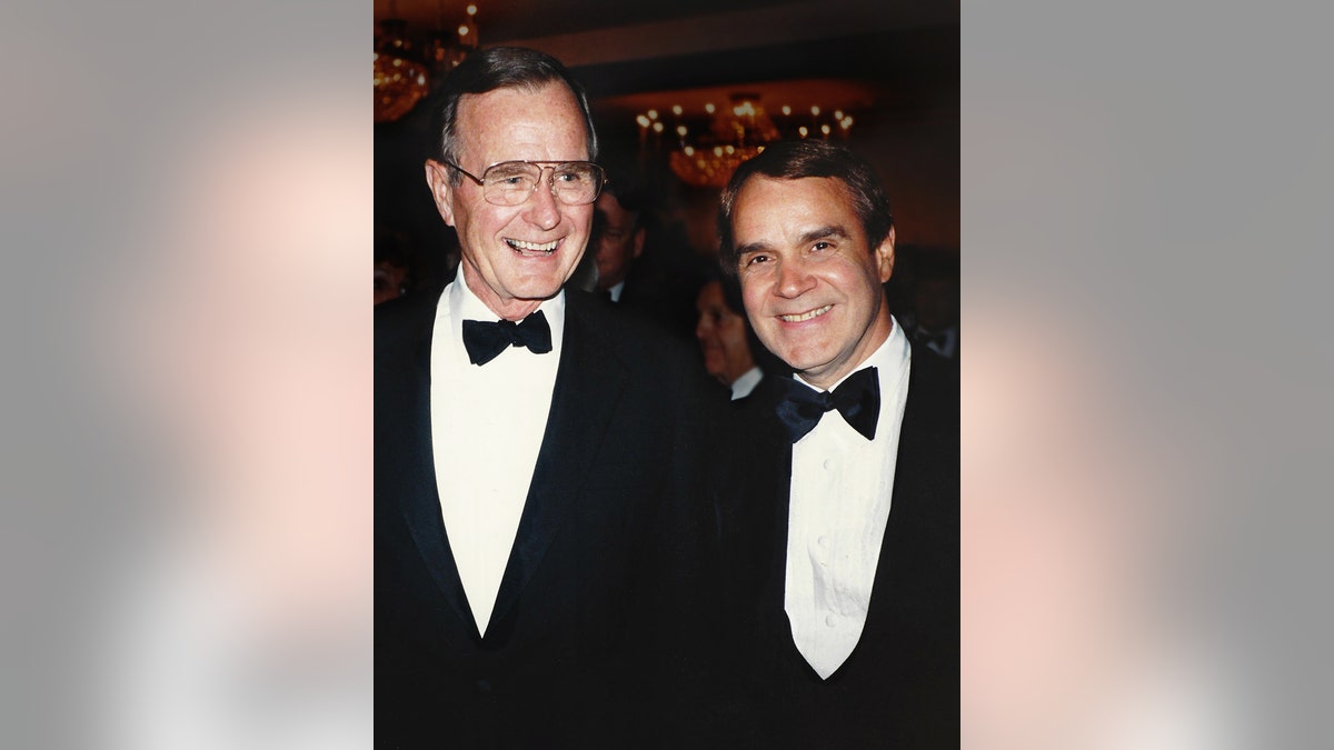 Rich Little and George H.W. Bush smiling