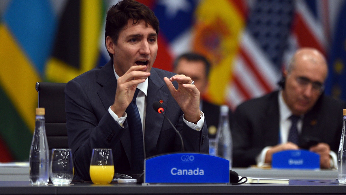 In this photo released by the press office of the G20 Summit Canada's Prime Minister Justin Trudeau attends a plenary session on the second day of the G20 Leader's Summit in Buenos Aires, Argentina, Saturday, Dec. 1, 2018. (G20 Press Office via AP)