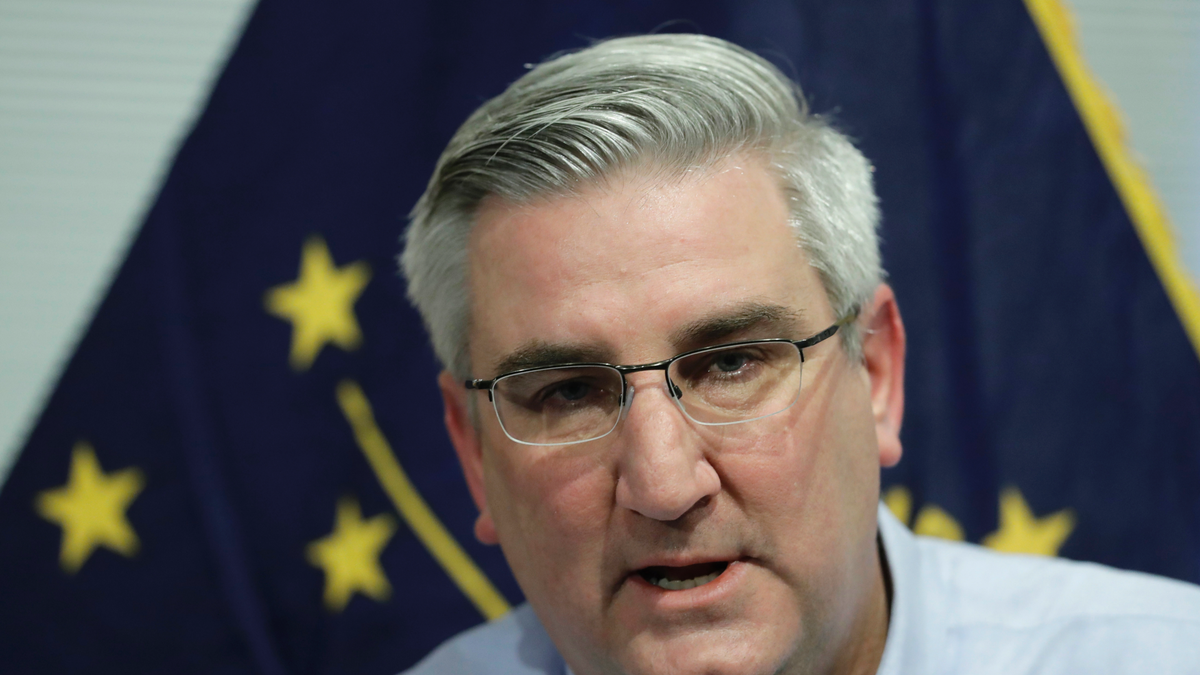 Eric Holcomb signed wearing a blue shirt