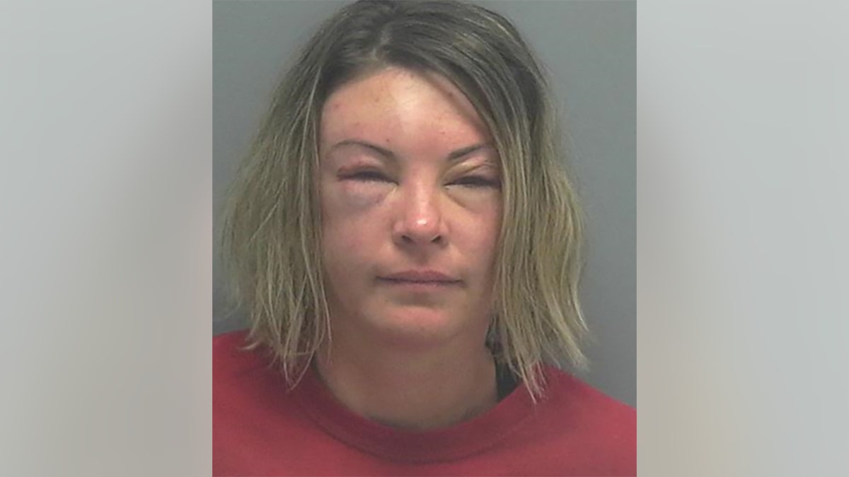 Jessica Blick, 37, was arrested after striking an officer with a concrete block, police say.