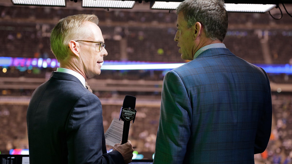 This Oct. 11, 2018, file photo shows Troy Aikman, right, and Joe Buck working before an NFL football game between the New York Giants and the Philadelphia Eagles in East Rutherford, N.J. (Associated Press)
