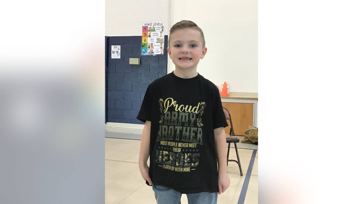 The kindergartner wearing a t-shirt that reads, "proud Army brother."