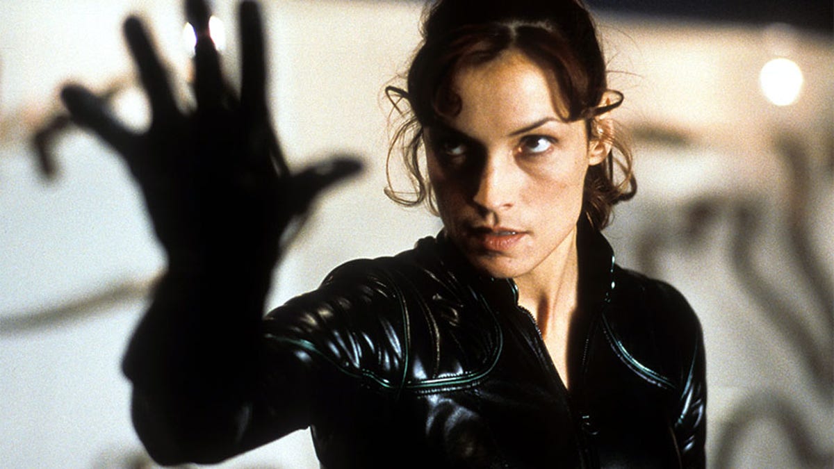 Famke Janssen holds up her hand in a scene from the film "X-Men," 2000.
