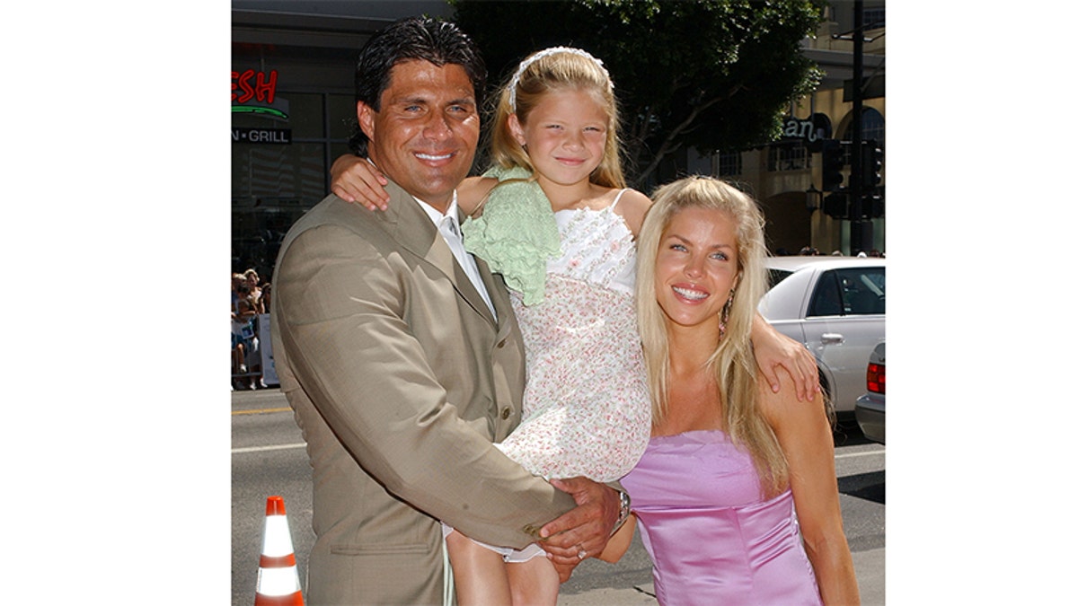 Jose Canseco, daughter Josie and then-wife Jessica. — Getty
