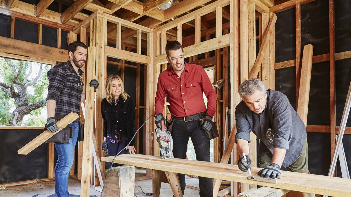 (From left to right) Drew Scott, Maureen McCormick, Jonathan Scott and Christopher Knight on the set of HGTV's upcoming series "A Very Brady Renovation."