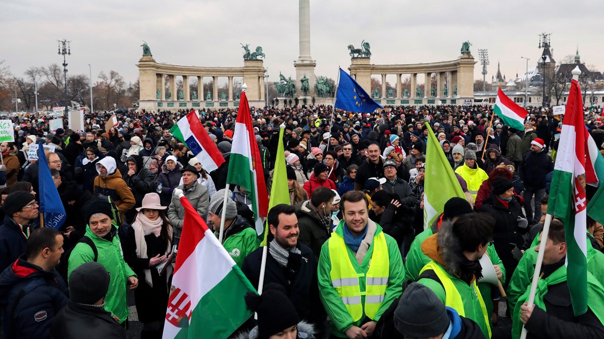 Participants of the anti-government demonstration under the title Merry Christmas, Mr. Prime Minister gathering in Heroes' Square in Budapest on Sunday. (Balazs Mohai/MTI via AP)