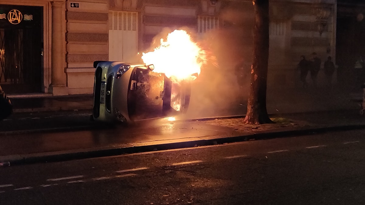 Protesters set a car on fire Saturday evening after a day of clashes with police.