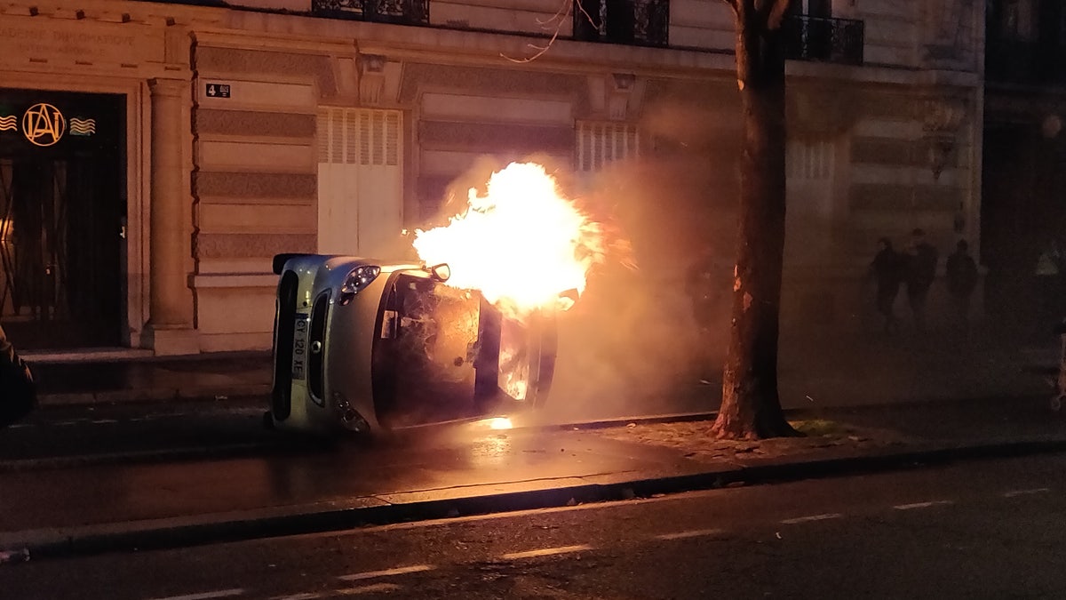 Protesters set a car on fire Saturday evening after a day of clashes with police.