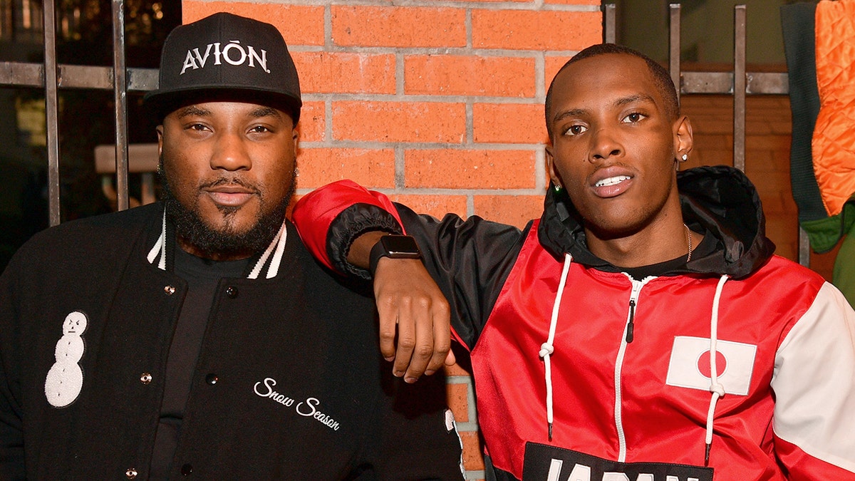 Jadarius Jenkins, right, son of rapper Jeezy, left, reportedly suffered a knife wound to the face during an altercation in Georgia.