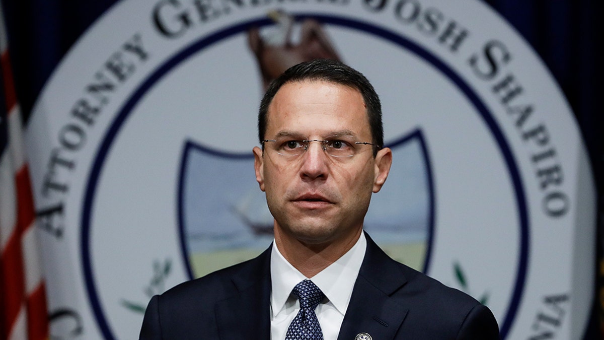 Pennsylvania's highest court says the names of 11 Roman Catholic clergy cited in a grand jury report on sexual abuse of children can't be made public. Attorney General Josh Shapiro says that although he can't release the names, the state's bishops should. (AP Photo/Matt Rourke)
