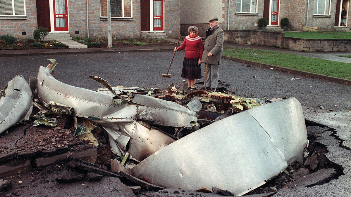 Local resident Robert Love stands by one of the four engines of the ill-fated Pan Am 747 Jumbo jet, 22 December 1988, that exploded and crashed 21 December on the route to New-York, with 259 passengers on board.