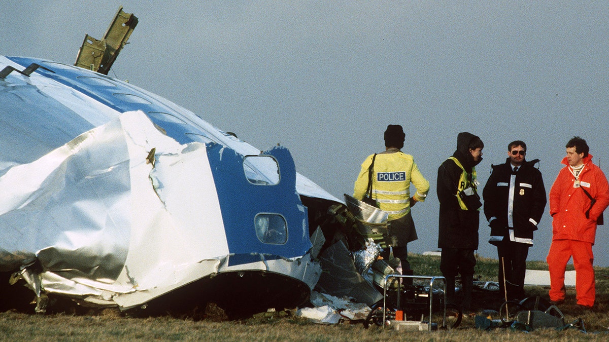 Scottish rescue workers and crash investigators search the area around the cockpit of Pan Am flight 103 in a farmer's field east of Lockerbie Scotland after a mid-air bombing killed all 259 passengers and crew, and 11 people on the ground.