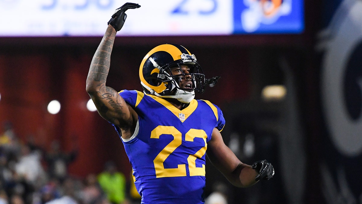 Cornerback Marcus Peters #22 of the Los Angeles Rams urges on the crowd during the fourth quarter against the Philadelphia Eagles at Los Angeles Memorial Coliseum on December 16, 2018 in Los Angeles, California.