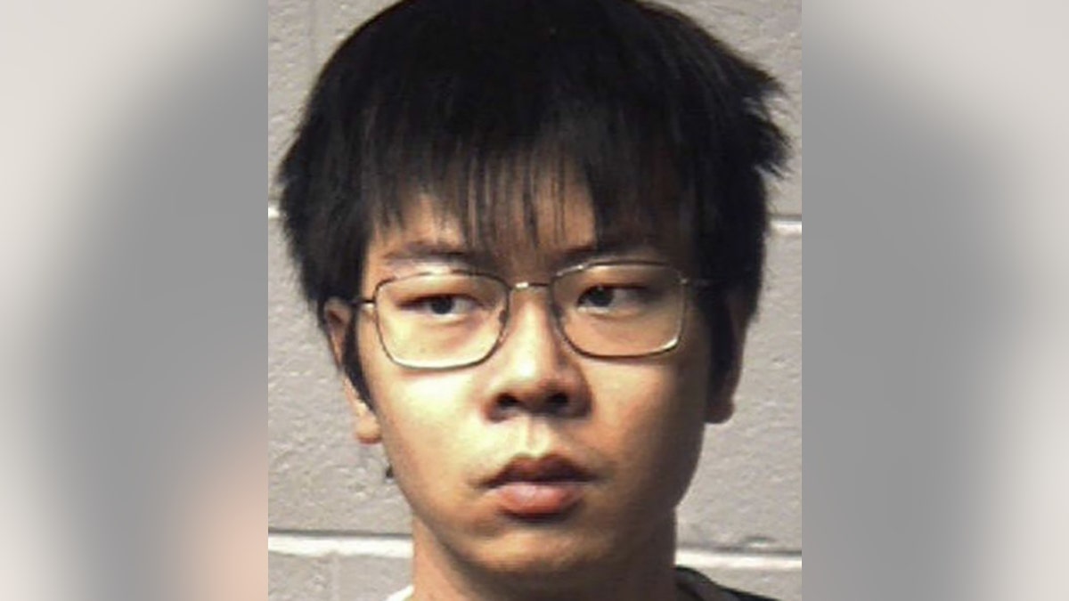 Yuaki Yang, 22, is accused of poisoning his African-American roommate, officials say.