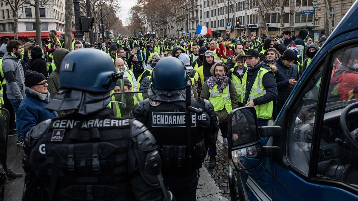 Protester on the Rue Marceau, in front of the Place de l'Etoile, during demonstration of the "Yellow Vests", in Paris, France, on December 8th 2018.