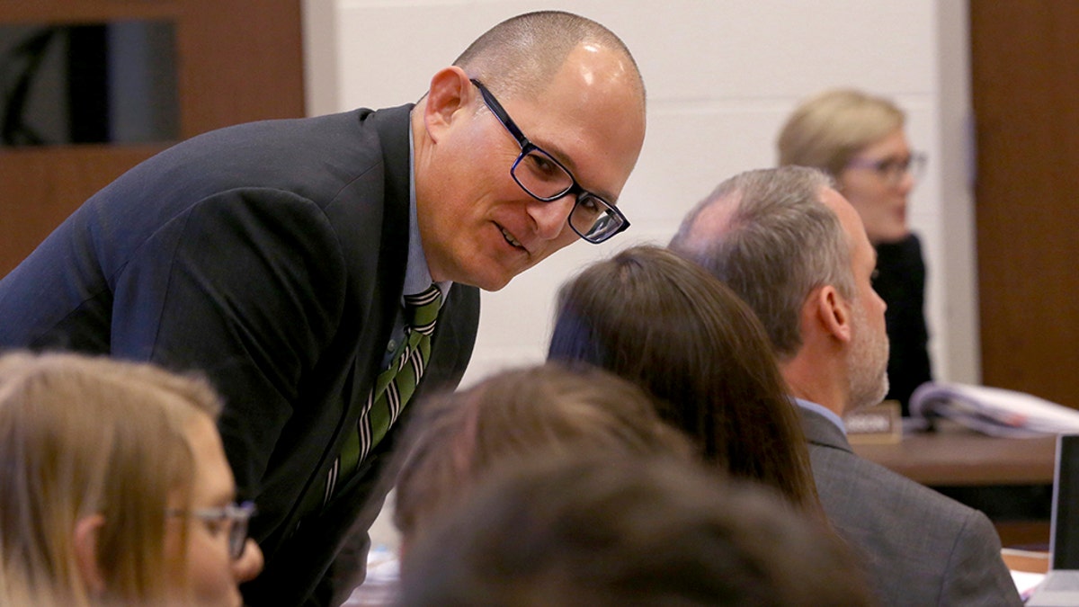 High school teacher Peter Vlaming chats at a West Point School Board hearing in West Point, Va., Dec. 6, 2018. The board voted unanimously to dismiss Vlaming.