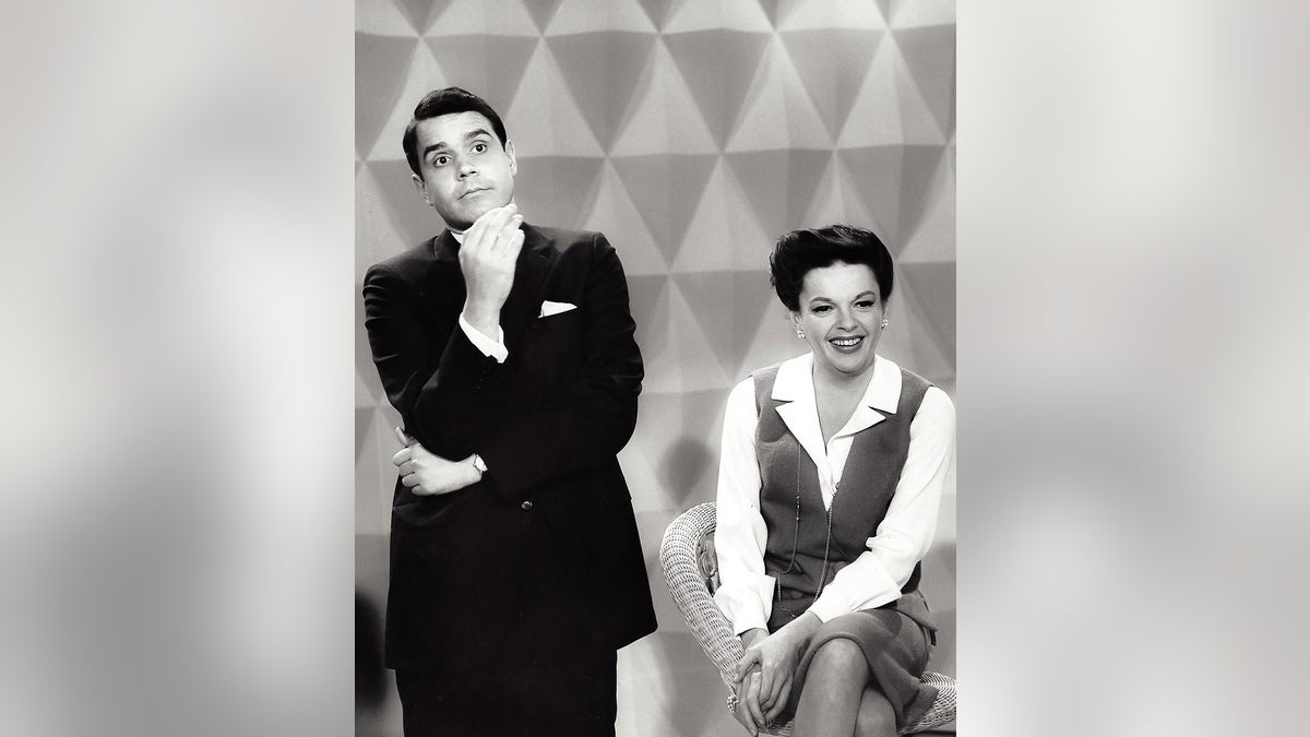 Rich Little posing with Judy Garland