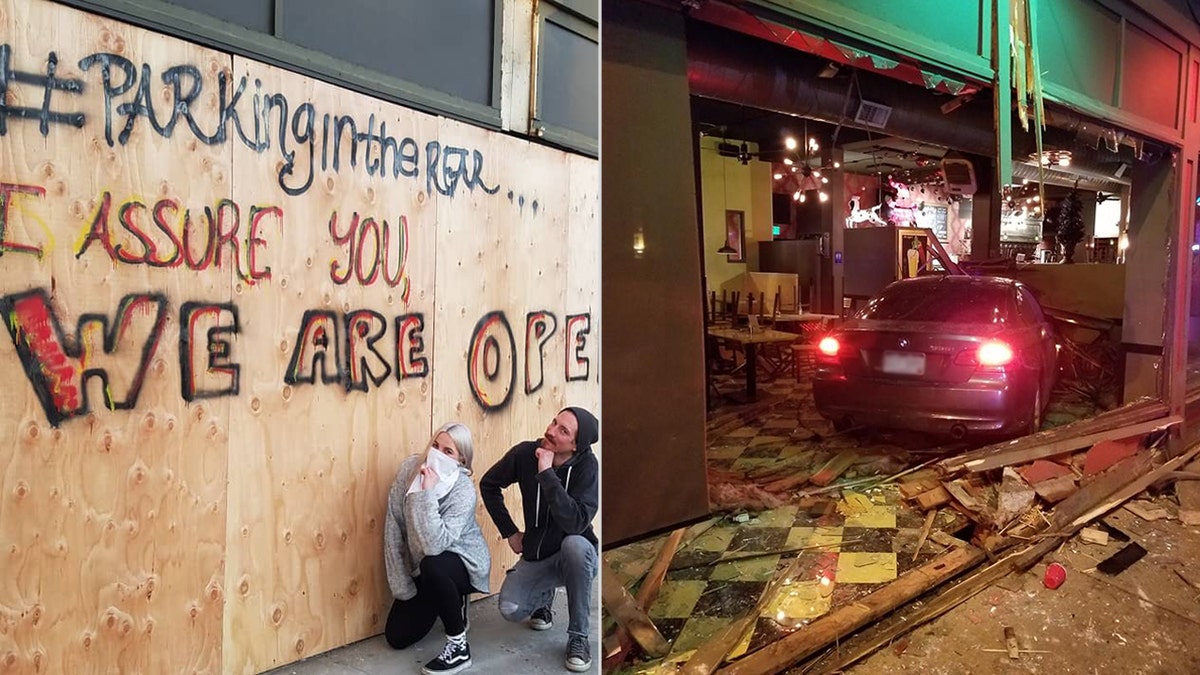 Employees at The Hornet pose with the plywood covering the damage to the restaurant after a car rammed through the windows on Saturday morning.