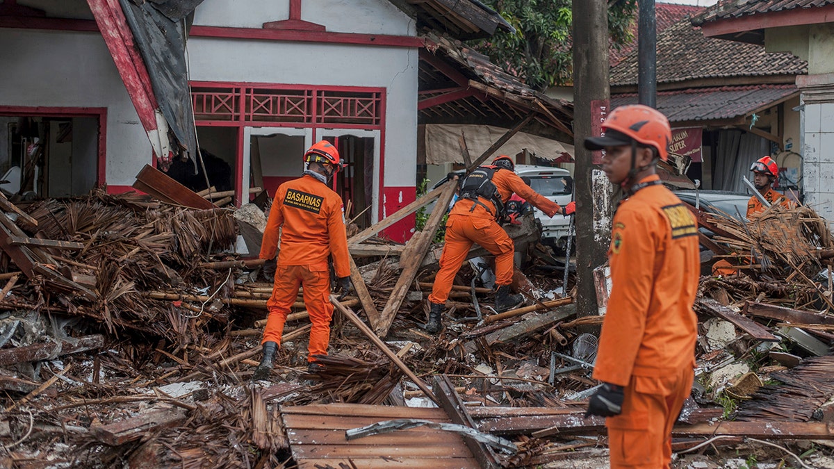 Rescuers search for tsunami victims in Carita, Indonesia, Sunday. (AP Photo/Fauzy Chaniago)